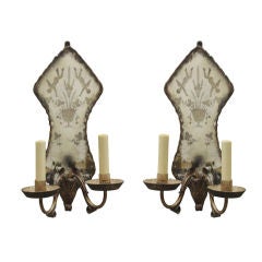 A Pair of Italian Wall Sconces with Shaped Mirrored Back Plates