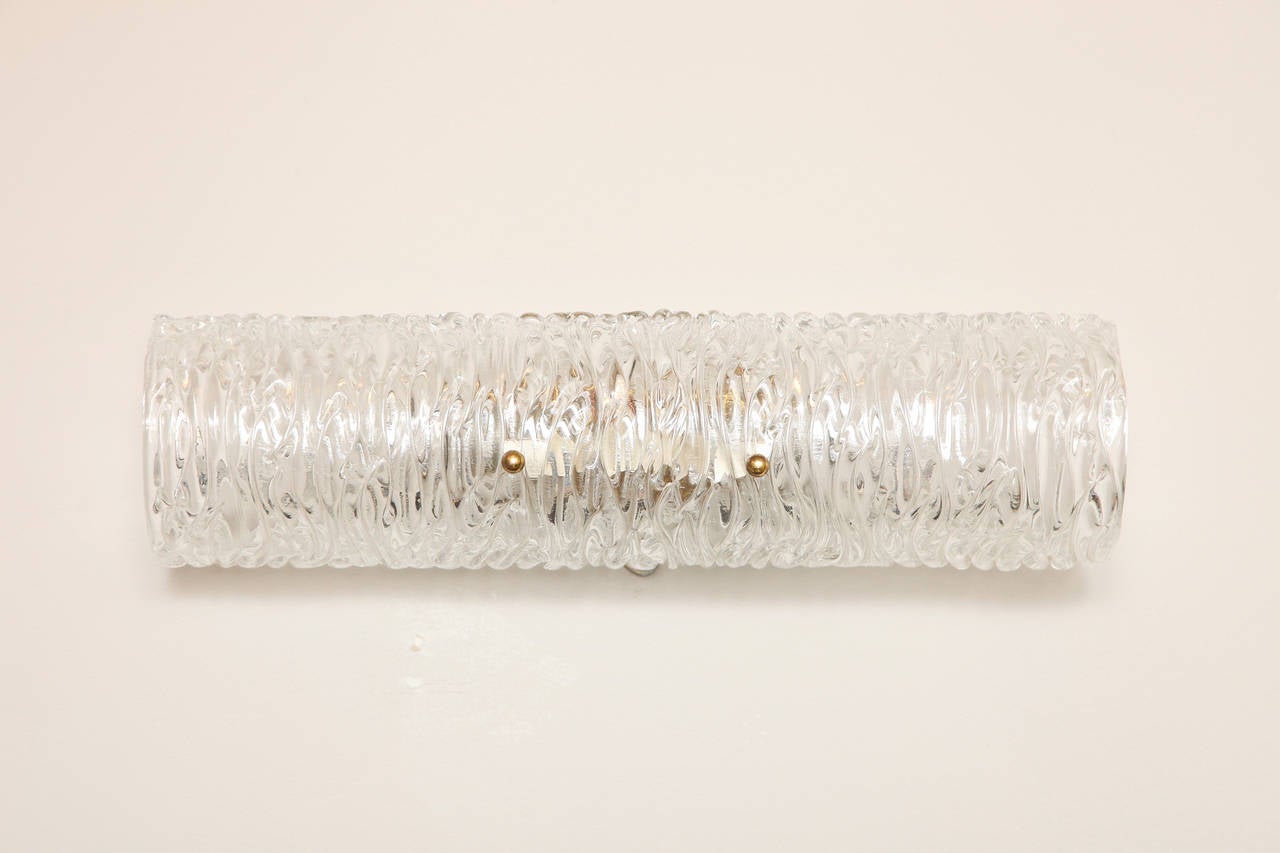 A Contemporary design German horizontal textured glass vanity light. The shaped glass concealing two candelabrum sockets.