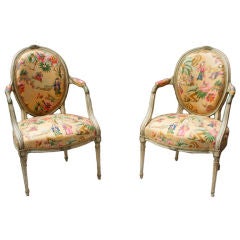 A Pair of English George the III Style Oval Back Open Armchairs