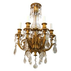A 6 Light Gilt Bronze and Crystal Louis XVI Style Chandelier