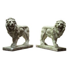 A Pair of Symmetrical Reconstituted Stone Recumbent Lions