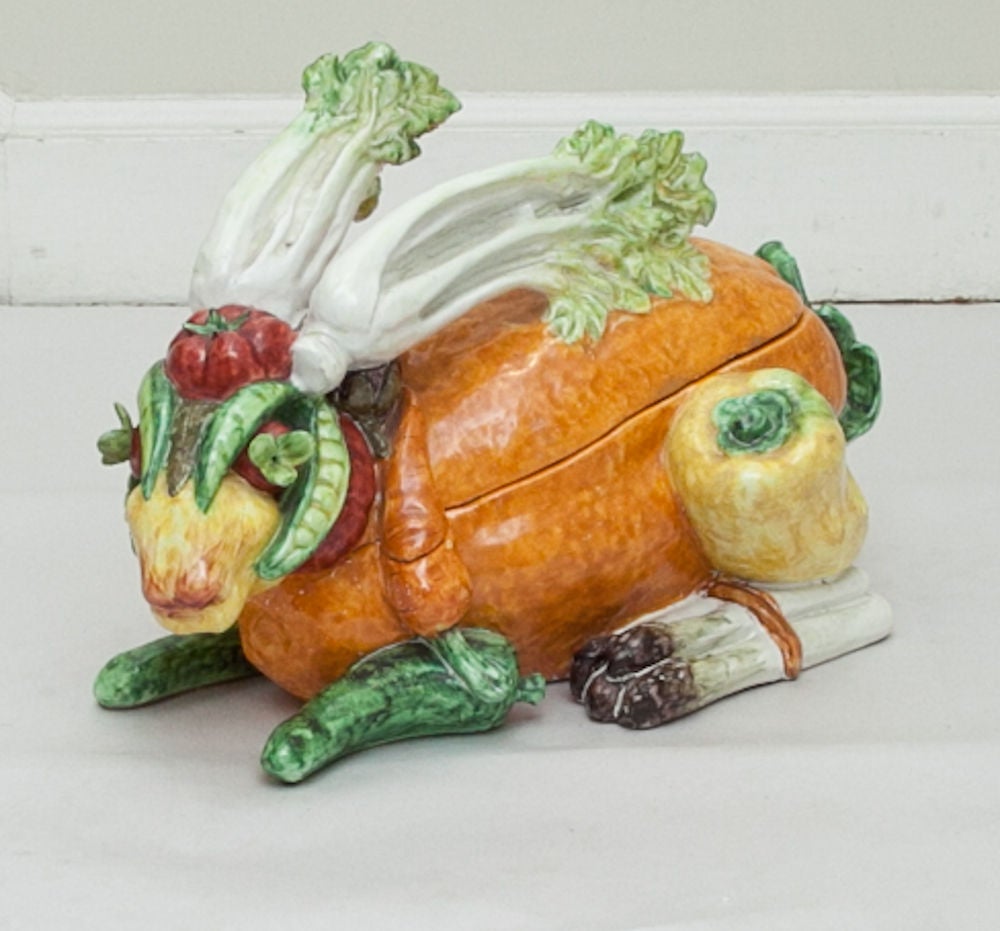 An Italian rabbit shaped covered tureen in the form of a pumpkin with head, ears, haunches, and feet formed by vegetables in the manner of Archibaldo bearing retailer's label on underside: Bonwit Teller.