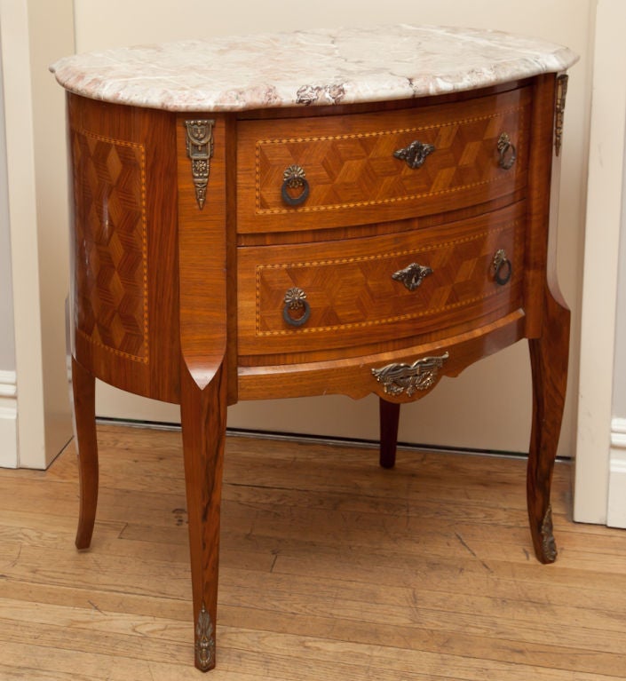 A Pair of oval transitional Louis XV Louis XVI style 2 drawer