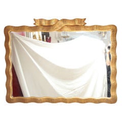 A horizontal American mirror with wood gesso frame