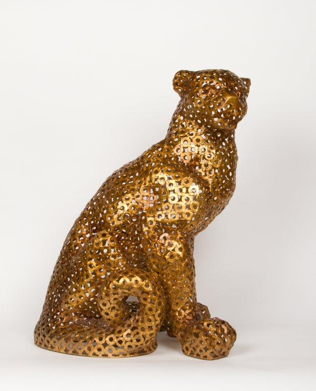 An Italian gilt metal panther the body formed by welded round flat rings.