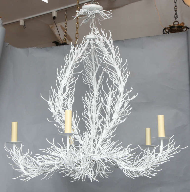 An American five light enameled metal and steel chandelier with cage form center and arms formed to resemble branches of coral.