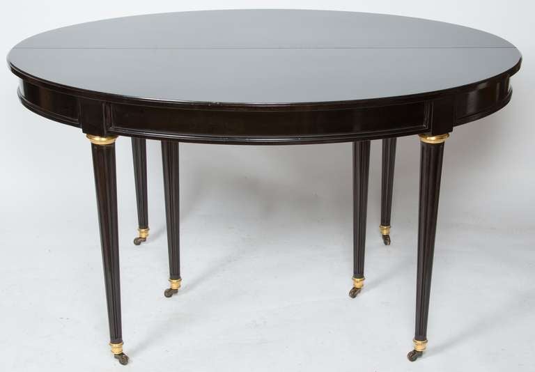 Bronze A French Louis XVI-style Ebonized Dining Table