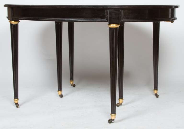 A French Louis XVI-style Ebonized Dining Table 1
