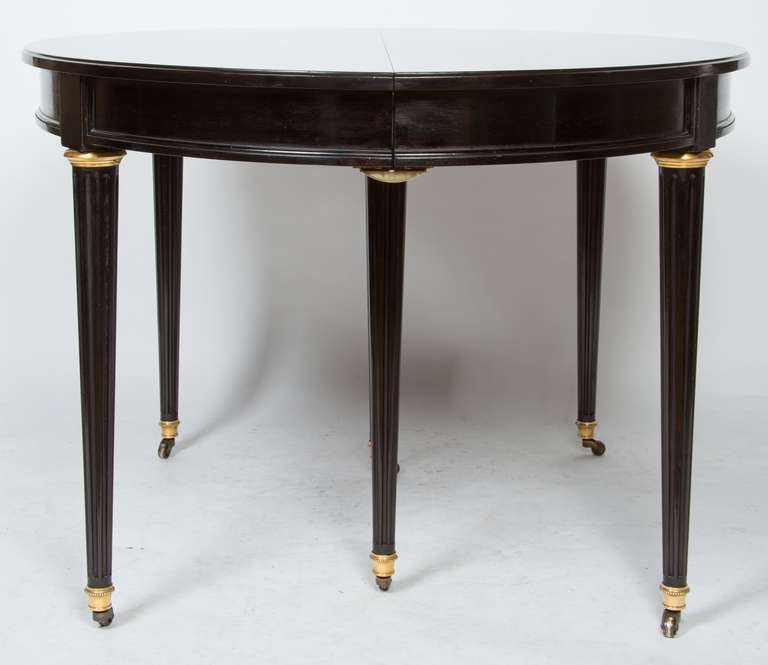 A French Louis XVI-style Ebonized Dining Table 3