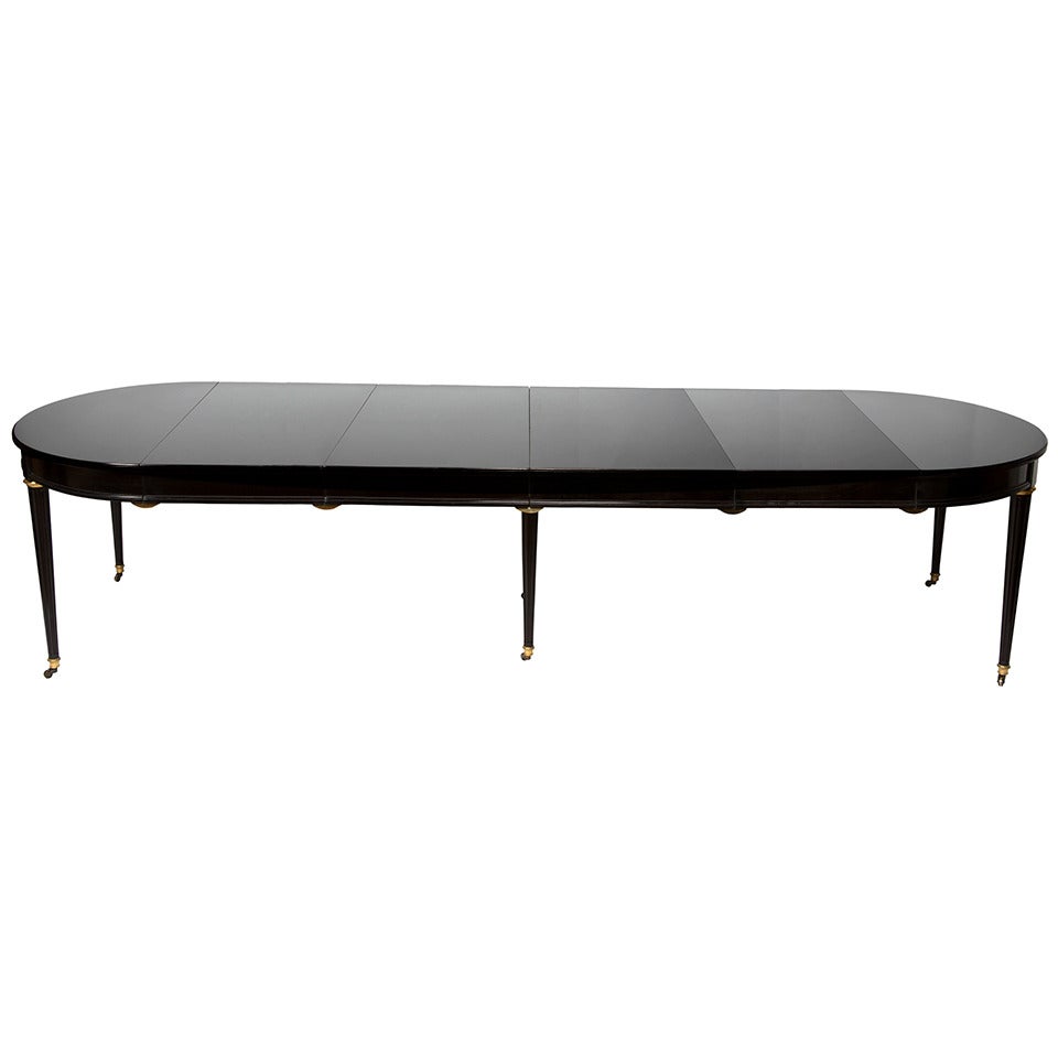 A French Louis XVI-style Ebonized Dining Table
