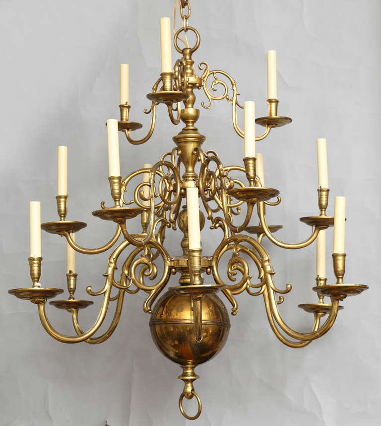 A 15 light three-tiered Dutch Baroque style polished bronze chandelier with ball on underside (electrified.)