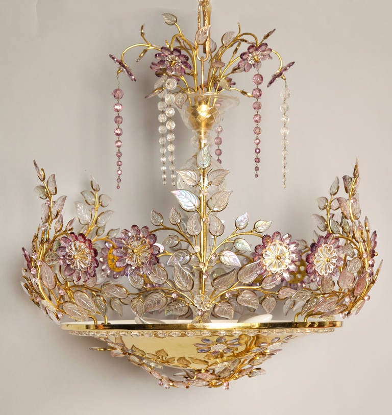 A French dish form ceiling light with branches of crystal leaves and flowers formed of beads encircling edge, the underside inset with crystal beads and having stem covered with sections of cut crystal. By French firm Bagues.