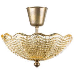 A Swedish Orrefors Ceiling Fixture with Light Amber Colored Molded Glass