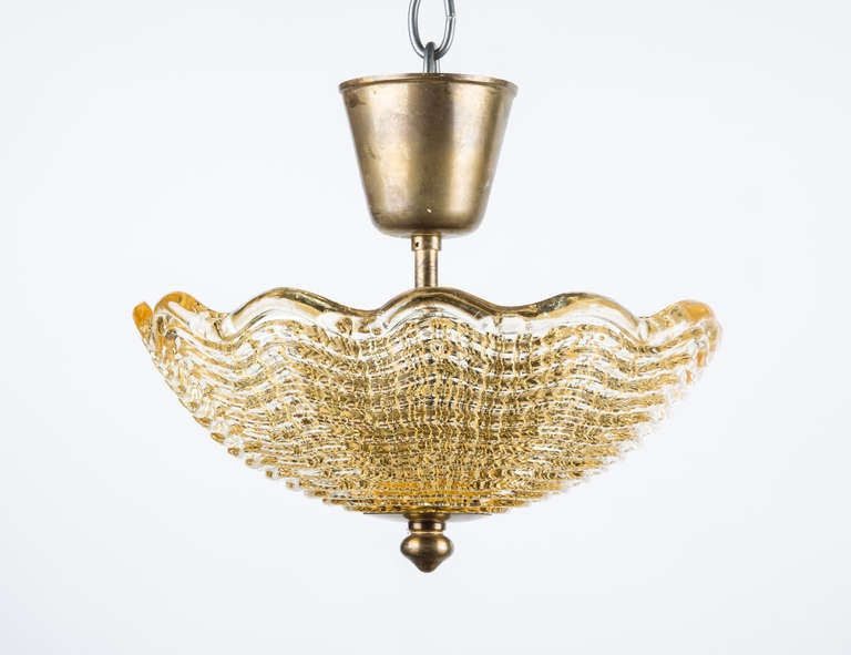 A Swedish Orrefors Ceiling Fixture with Light Amber Colored Molded Glass