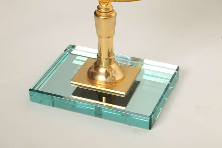A Round Gilt Metal Magnifying Mirror In Excellent Condition In New York, NY