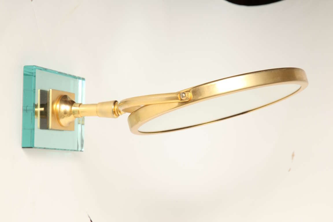 A Round Gilt Metal Magnifying Mirror 1