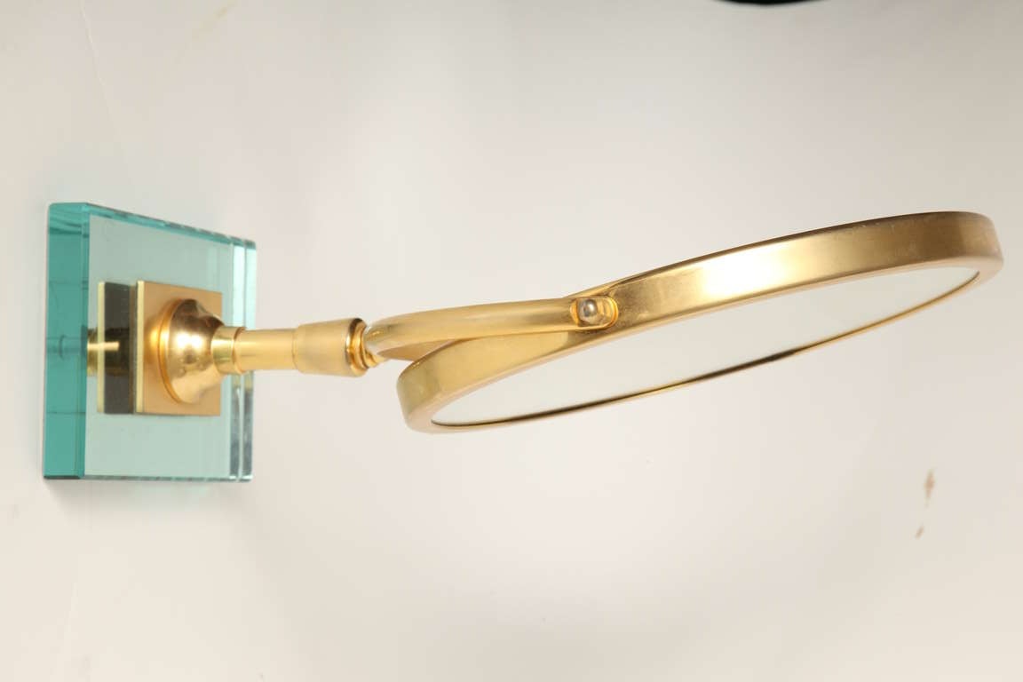 A Round Gilt Metal Magnifying Mirror 2