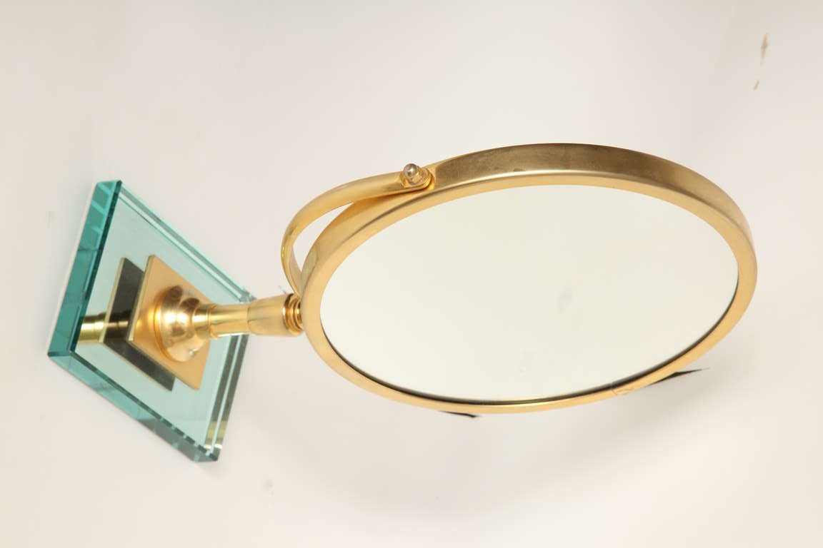 A Round Gilt Metal Magnifying Mirror 3