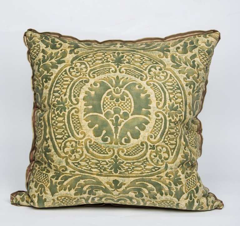 A pair of 1950s Fortuny fabric cushions made with vintage Orsini pattern fabric having pineapple motif within medallion and striped silk fabric backs.