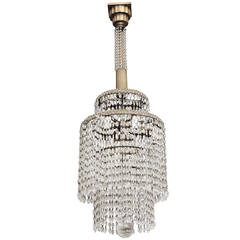 A French Art Deco Crystal Chandelier in the Manner of Emile-Jacques Ruhlmann