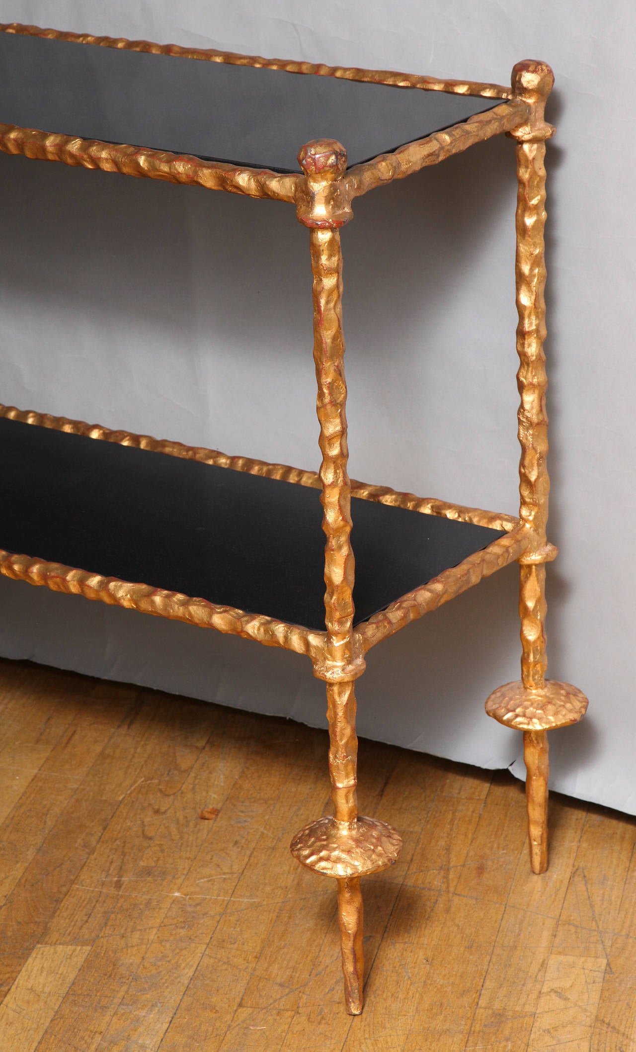 A Two Tiered Gilt Iron Giacometti Style Sofa Table In Excellent Condition In New York, NY