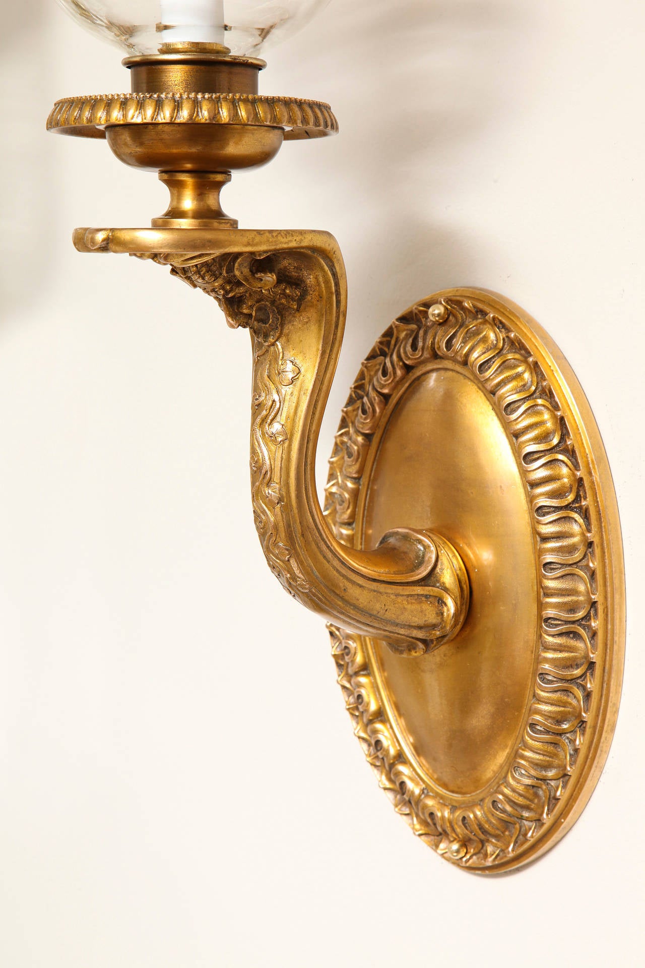 Early 20th Century A Pair of Signed Neo-Grec Hurricane Wall Sconces by E.F Caldwell 