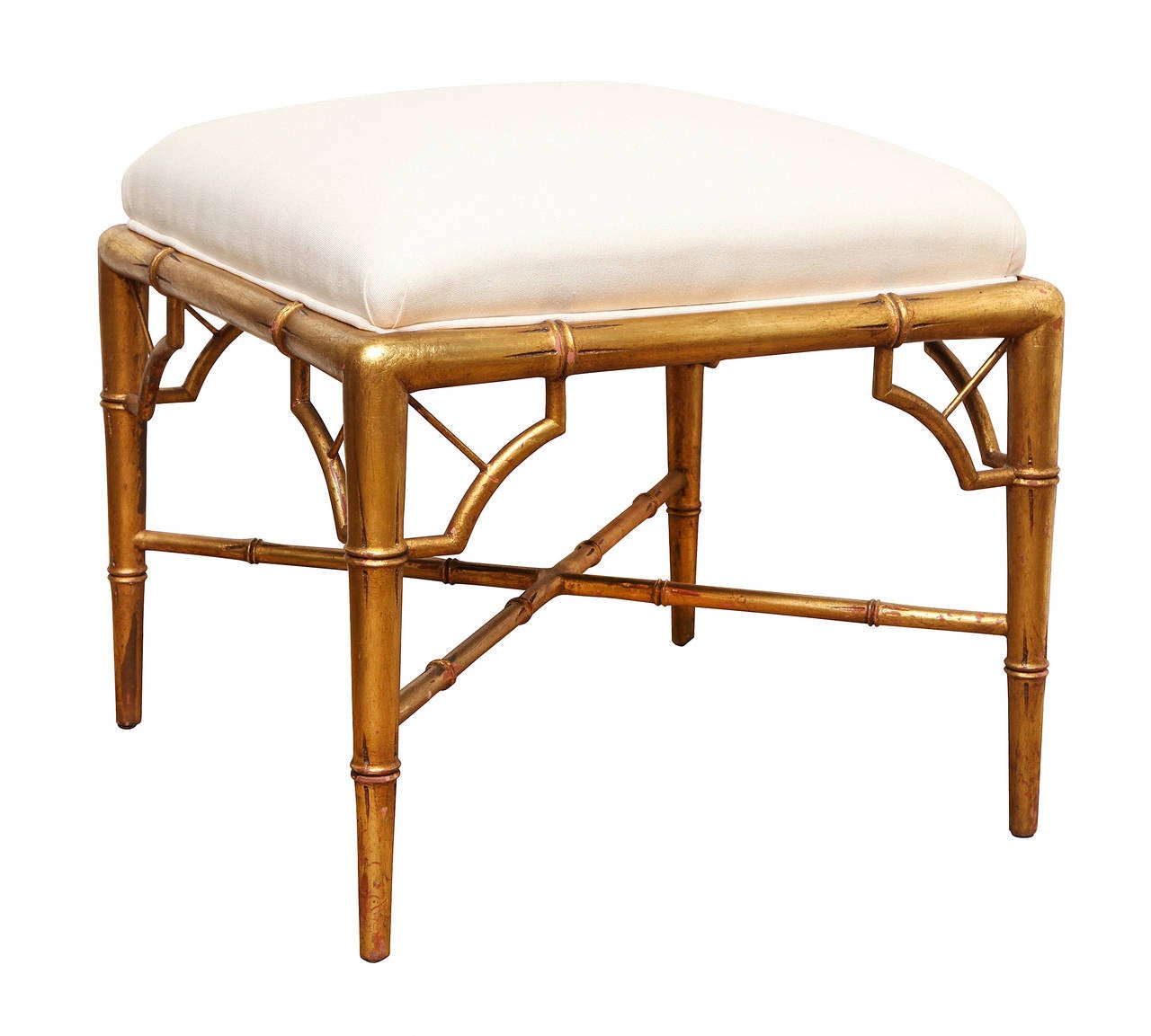 A pair of square American faux-bamboo ottomans, the muslin upholstered slip seats above frame with molded edge and tapering legs with open fret brackets and x-shaped stretchers.