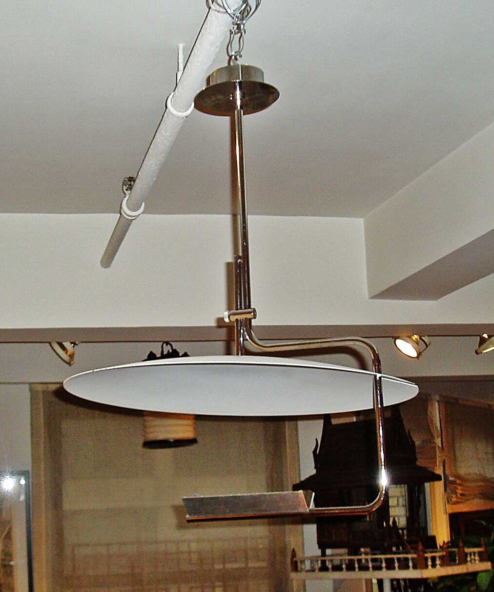 A stainless pendant ceiling light fixture from Paris, circa 1950s. Rewiring to US standard needed, not included.