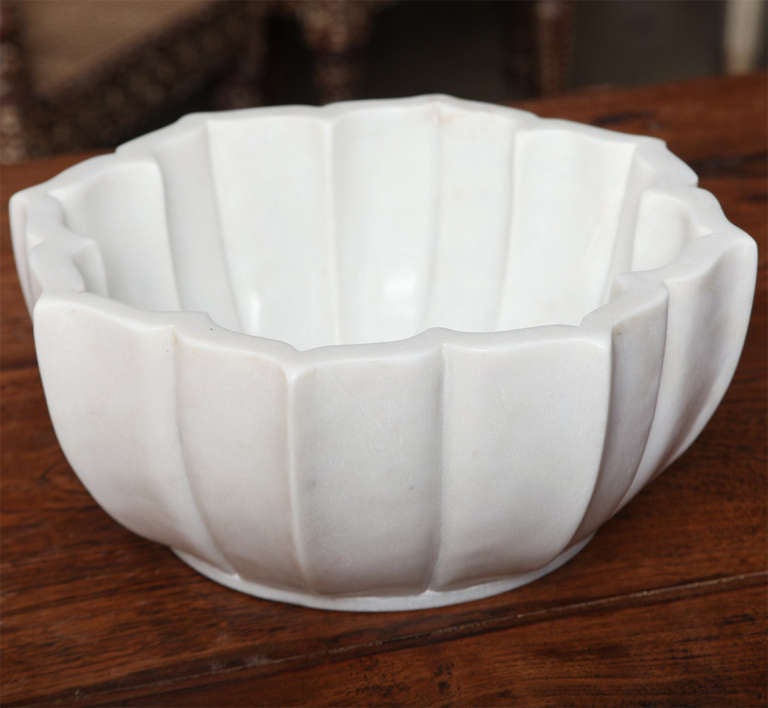 A deep white marble bowl from India.