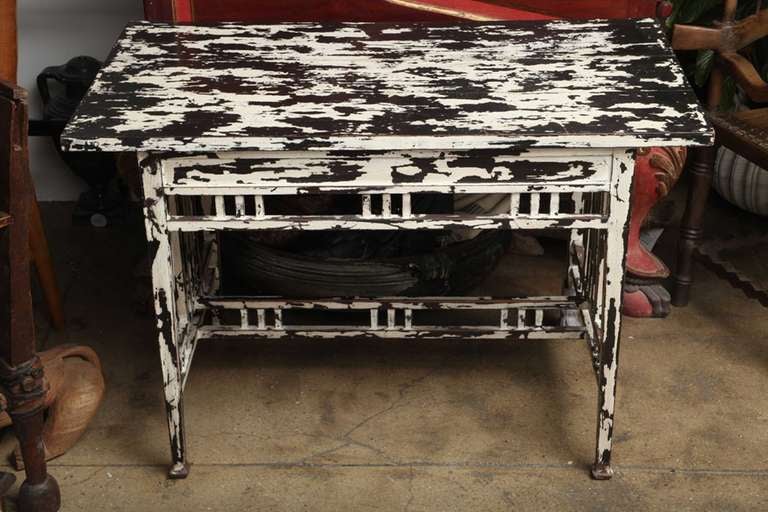 A samerang table, in black and white distressed finish, from Indonesia.