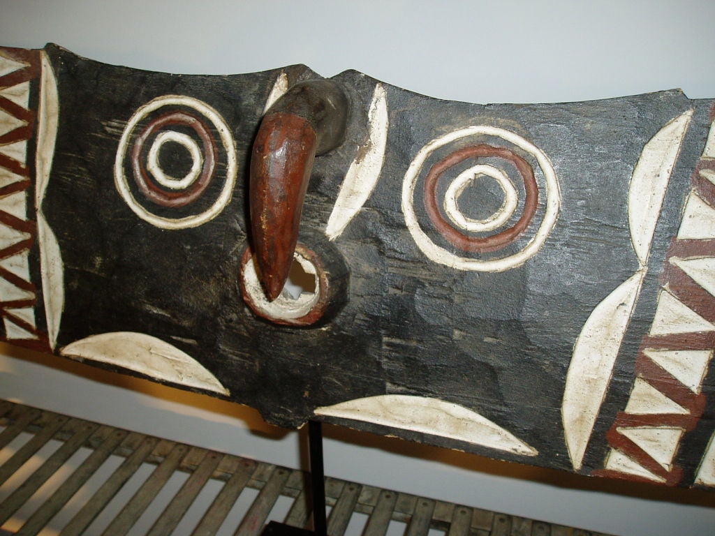 A large Bwa or Bobo ceremonial mask from Burkina Faso in west Africa.  Hand-carved and painted. On a stand.