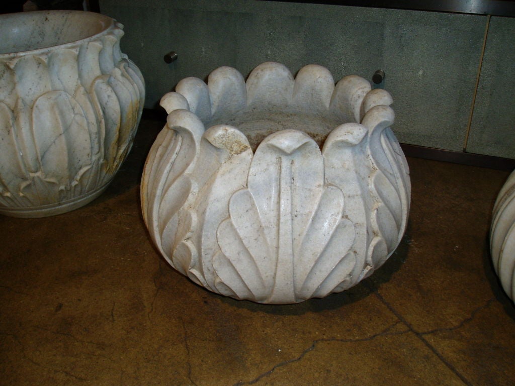 A vintage white marble planter/jardiniere from India with carved symmetrical leaf pattern.