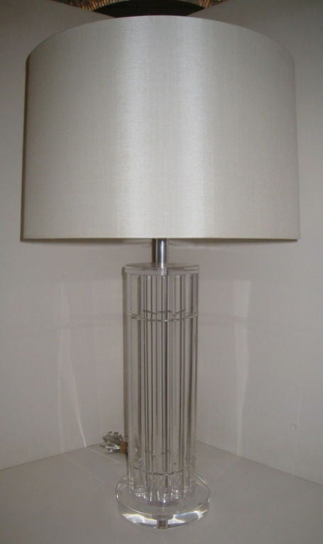 Pair of Lucite Lamps with Circular Base and 12 cylinder tubes that make up the Body of the Lamp. These were produced by Rittsco the business of photographer Herb Ritts parents in Los Angeles