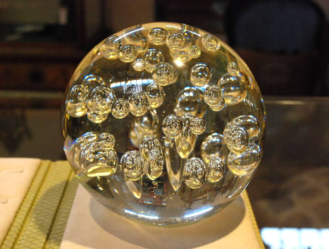 An impressive Murano glass ball paperweight. Decorated with large bubbles.