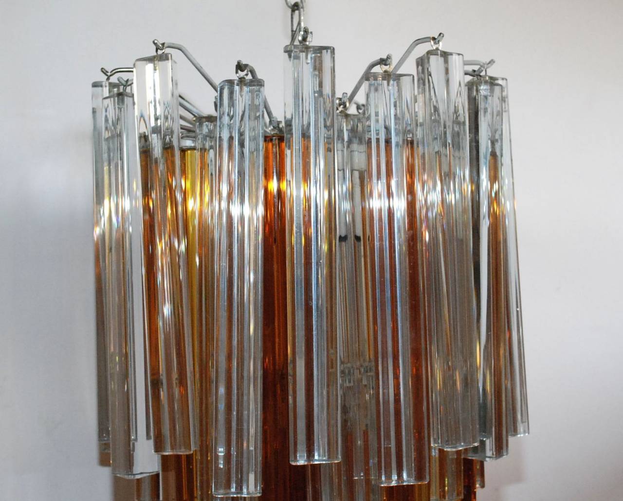 A Venini clear and amber Murano glass triedri chandelier. Has three lights. Height provided is for fixture only (chain and canopy extra).