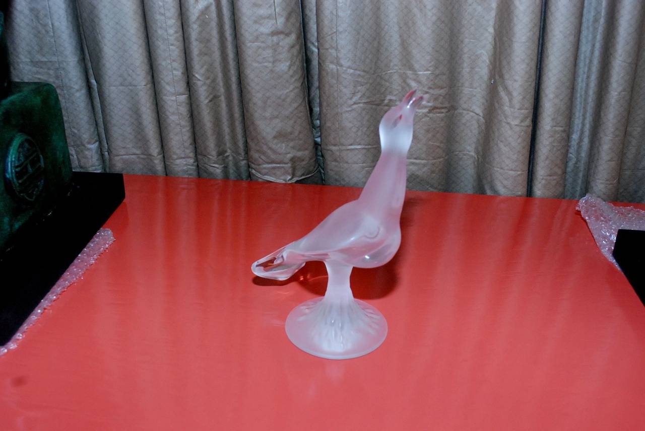 A frosted glass bird by Lalique. Signed on base 