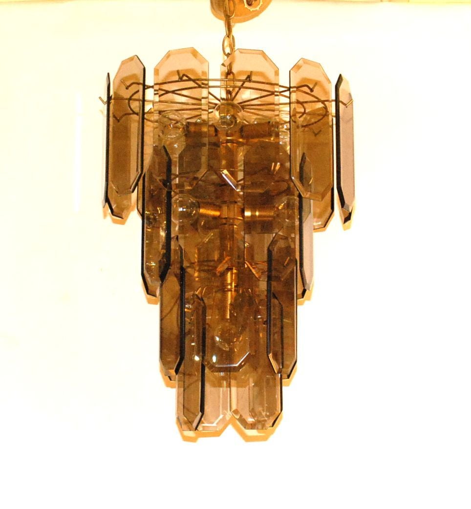 Ten-light smoked glass Italian chandelier with brass finish frame.