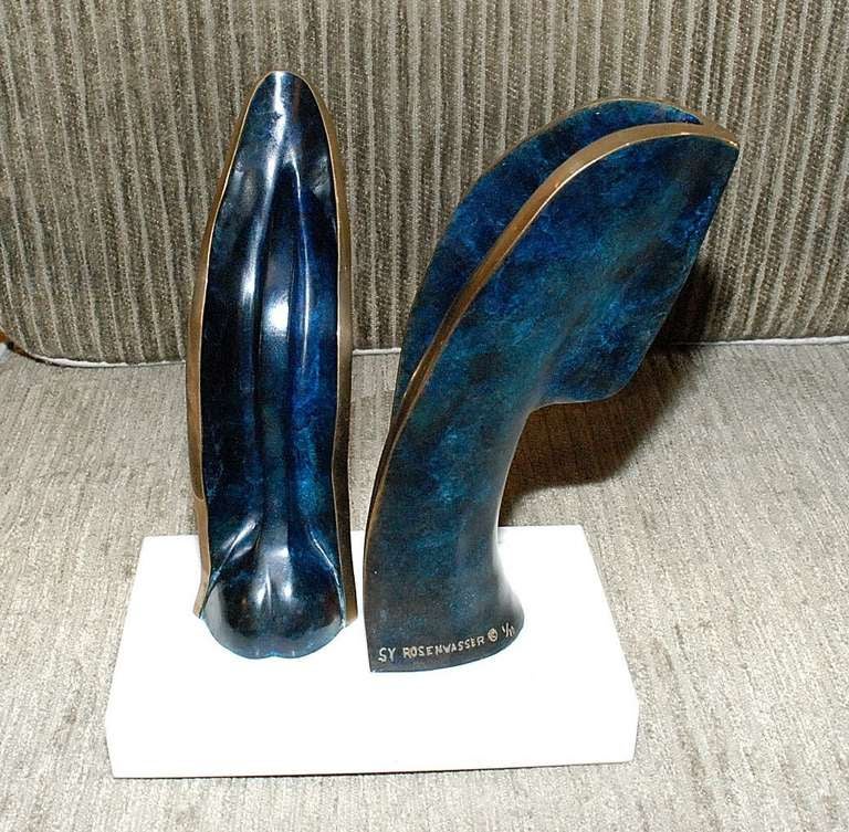 Elegant blue and gold patina bronze sculpture with white marble base signed Sy Rosenwasser Number 1/10.

Sy Rosenwasser work may be viewed in many public and private collections: the Hyatt Regency In Hawaii, The Bonaventure Hotel In Los Angeles,