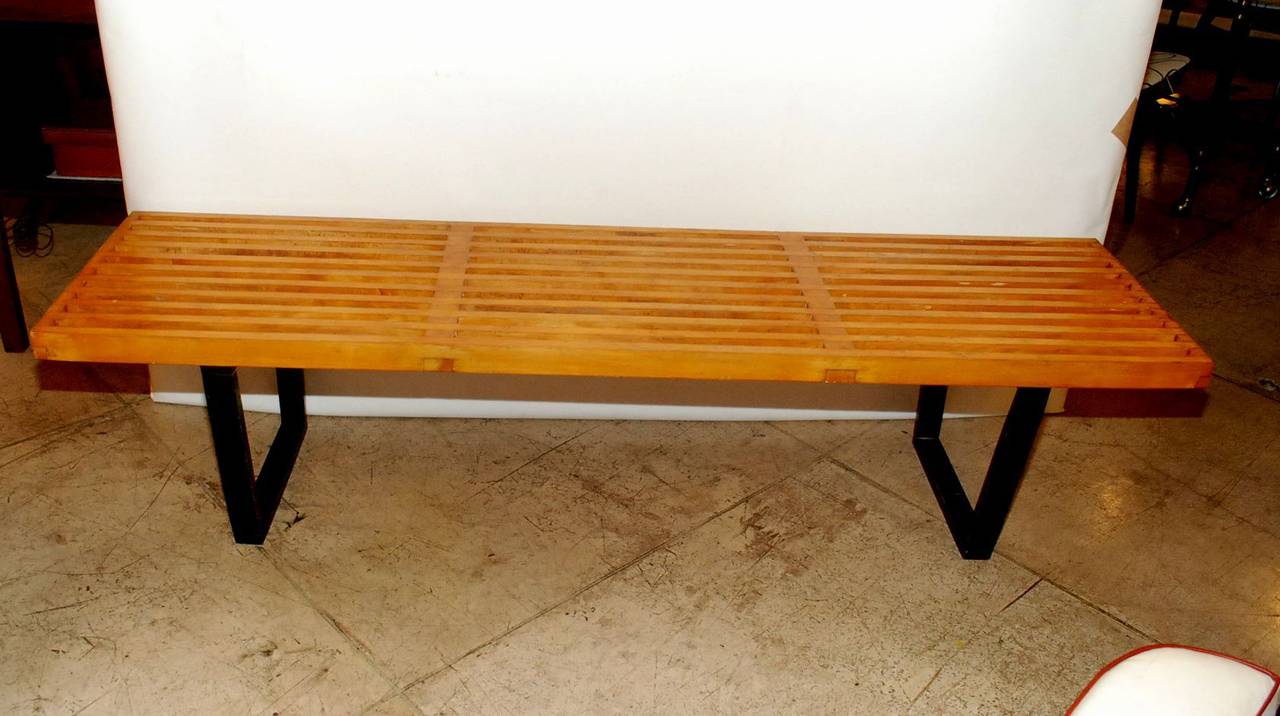 An early production George Nelson slatted bench/coffee table made by Herman Miller. It is in its original condition and has not be refinished. Top has a wonderful aged patina.