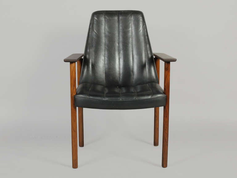 Sven Ivar Dysthe Model 3001 armchair in rosewood and black leather. Offered in high condition original channeled leather.