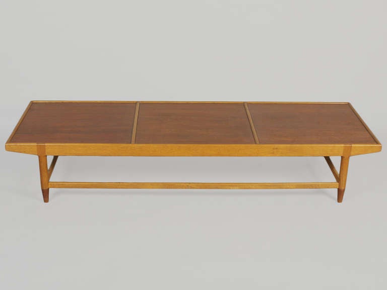 This is the first time we've seen this piece by the Norwegian Bendt Winge.  The teak and beech bench is segregated into three sections for adjustable placement of the companion table as a 2nd tier surface.  Makes for an interesting and warm platform