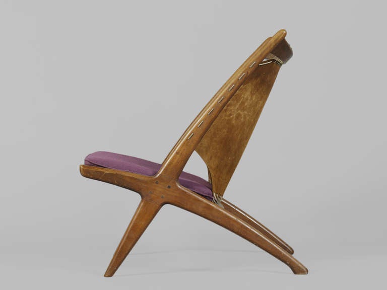 Vintage 1950s Vintage Norwegian Teak & Leather Slingback Chair by Frederik Kayser. Scandinavian Furniture.

Gorgeous Cross Lounge Chairs with slanted legs, leather sling-backs, and cushioned seats. Features a sculptural silhouette, exposed dowels,