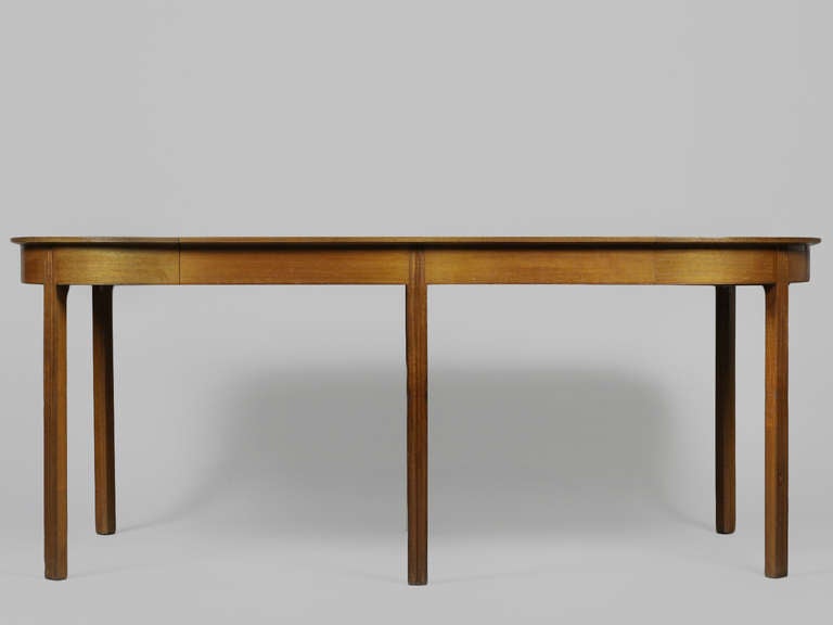 Vintage 1930s Dining Table with 2 Leaves, seats 10.

Wonderful transitional dining table made by the early design and cabinetmaking duo; Ole Wanscher and AJ Iversen.  Demonstrates the incremental migration from antique to danish modern design. 