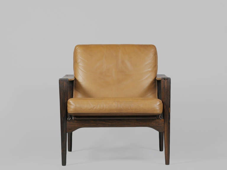 Handsome 1960's Danish Modern Solid Rosewood Lounge Chair by Kai Kristiansen.  Features slatted back, dovetail joinery, and original butterscotch leather upholstery.

Located at ABC Home 888 Broadway 2nd Floor, New York.