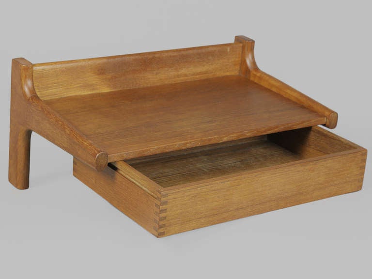 Finely-crafted Danish Modern Teak Wall Mounted Shelf by Hans Wegner. Features dovetail joinery and solid teak frame. Use as an entryway shelf or nightstand. 3 available. Price per shelf.