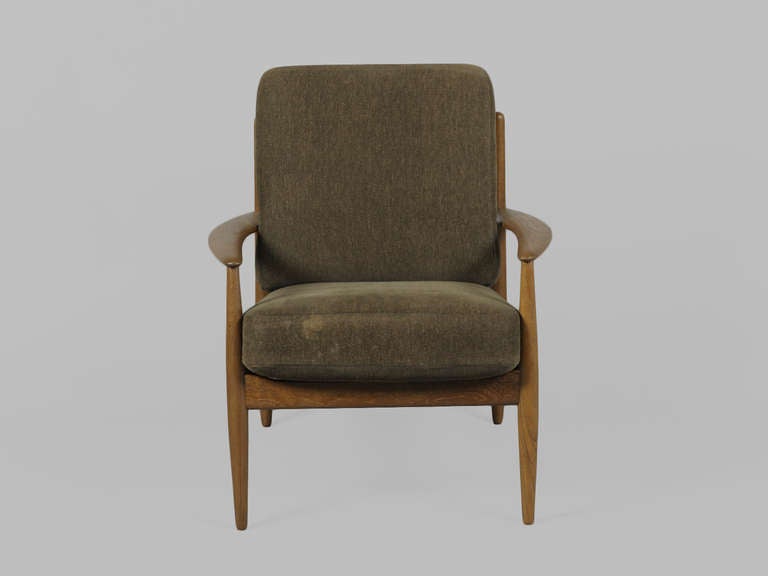 Pair of Danish Modern Teak Armchairs by Greta Jalk for France and Son.  Features tusk like arms, slatted back, and original spring cushions.