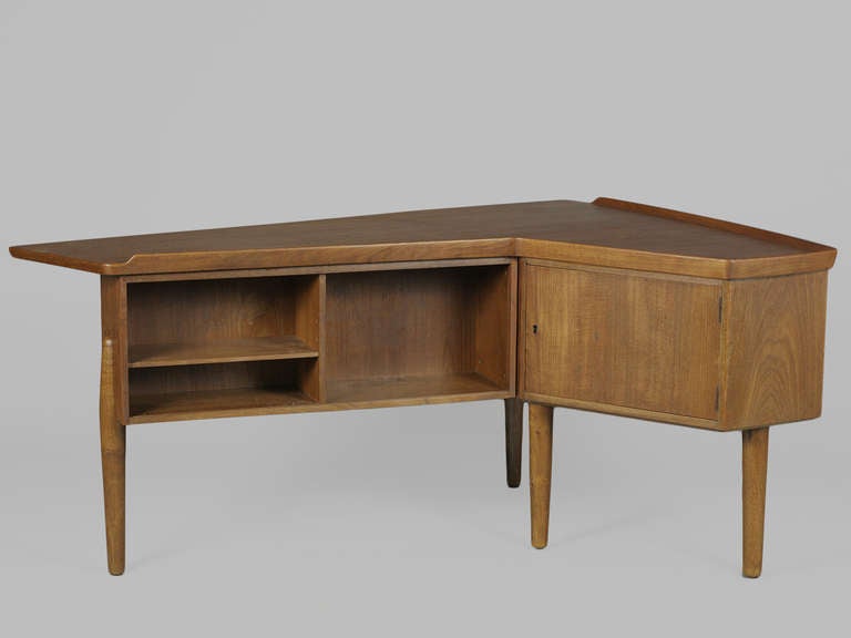 Atomic Era Design Style Teak Desk by Arne Vodder.  Features lipped edges, 3 deep drawers, and open shelves adjacent a mirrored bar cabinet on the opposite side.