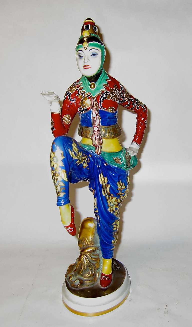 This is a rare porcelain figurine made by Rosenthal in about 1920. This figurine is one of the largest produced by Rosenthal at their Selb,Bavarian works. Designed by Constantin Holzer-Defanti and hand painted is in superb condition, no chips,