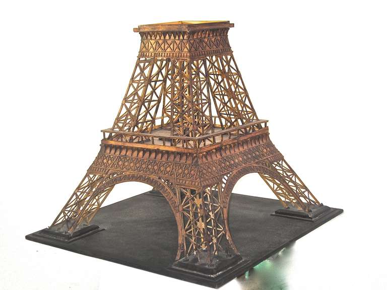 The Eiffel Tower built to welcome visitors and as an observation tower for the world's fair opened in 1889. This model includes the 1957 addition of the antenna. The generous size (65