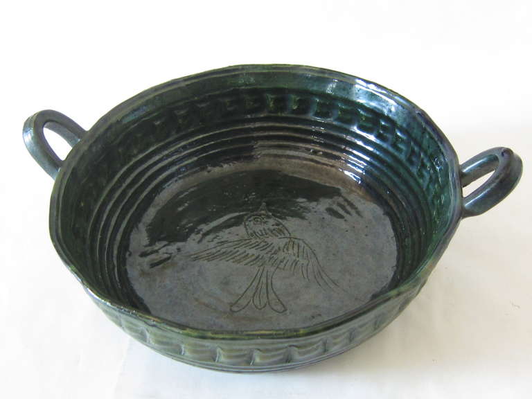 This Vintage Tlaquepaque Mexican Terra Cotta Serving Bowl c.1930's in a deep green glaze with impressed design and ringed and ribbed sides is from the Oaxaca area. This  glaze and the designs used by the artisans are beautiful but not plentiful. The